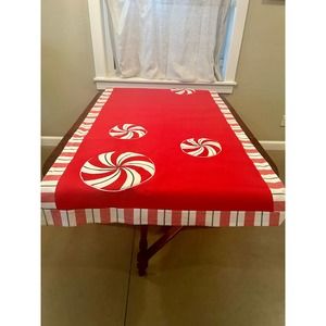 Aman Holiday table runner 37 x 88 inches. Used for display Christmas Candy.